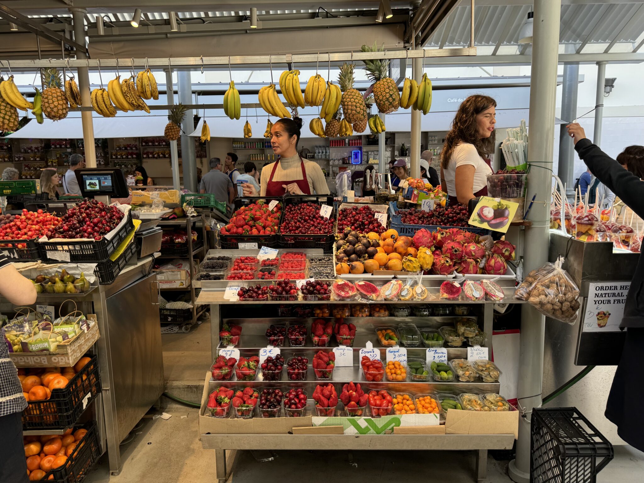 Fruit sellers at Mercado do Bahâo. Photo by ConsumerMojo.com