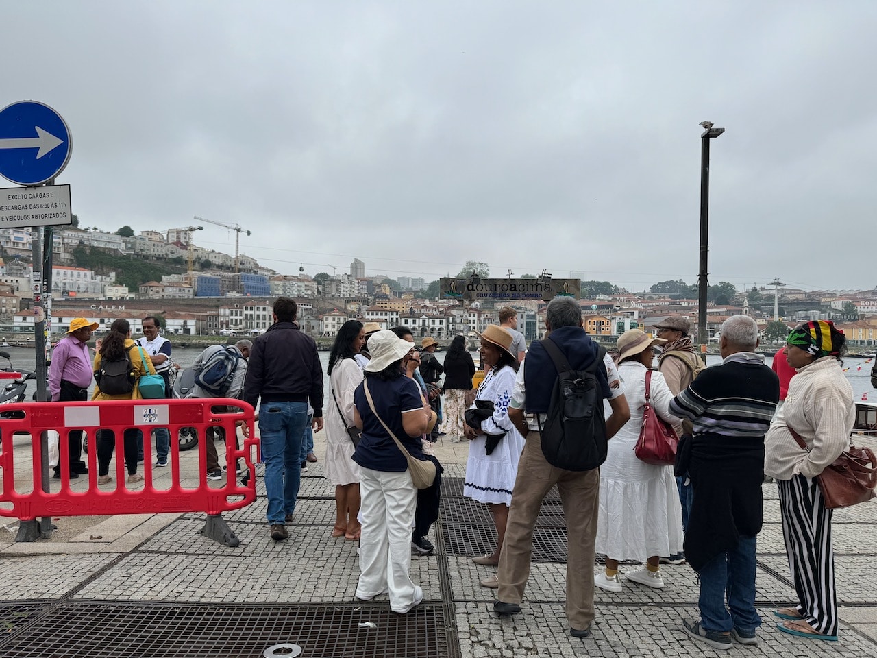 People lined up waiting for a boat.